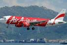 AirAsia QZ8501: Divers find bodies belted in seats near fuselage.