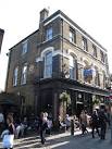 A Young's pub on Flask Walk (presumably the street named after the pub). - via Daymix