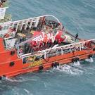 AirAsia flight QZ8501: Indonesian divers retrieve black box data.