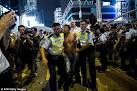 Hong Kong protesters attacked by shop owners as they are losing.