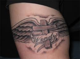 cross and angel wing tattoo