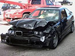 The BMW failing to take the curve, collided with a tree and then with the ...