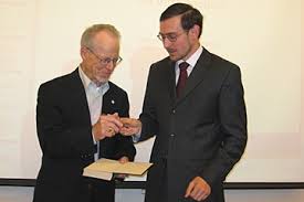 Oliver Williamson signs a book