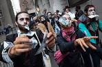 Occupy Wall Street protesters dressed as 'corporate zombies' lurch ...