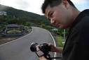 16, 2011 photo, filmmaker Lee Hui-ren pauses as he takes a photograph. - p20b