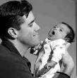 FATHER AND SON: Mike Levesque with his newborn son, Owen, ... - windsorstar03-19-05-fig1