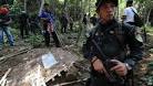 Malaysian police find 139 suspected migrant graves - BBC News
