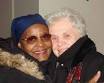 Mrs. Clark and Mrs. Figliulo embrace one another. Photo: Ernest Sanders - Neighbors_Reunited
