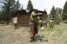 WILDFIRE GROWS, BUT TEAMS WORK TO SAVE COLO. TOWN