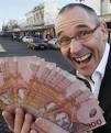 COME AND GET IT: Southland businessman Geoff Matthews with some of the money ... - 588379