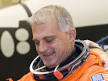 Dave Wolf, STS-127 mission specialist, dons a training version of his ... - 351645main_jsc2008e139786_wolf_med_thum