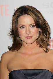 Danneel Harris Medium Length Layered Cut. This brunette hairstyle is full of body and bounce with gentle big curls. - BBC-027086