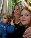 HOLDING THEM CLOSE: Vicki Anderson with two of her four children, Hollie, 2 - 4780569
