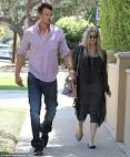 Heavily pregnant Fergie and husband Josh Duhamel go house hunting