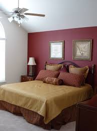 Large master bedroom with red accent wall paint | New Abbey Model ...