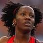 Kelly-Ann Baptiste of Trinidad and Tobago competes in the women's 200m heats ... - 53503_thumb