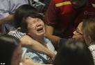 Chaotic scenes as hysterical relatives of Air Asia crash victims.