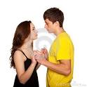 Teenagers Boy And Girl In Love Looking Face To Face Royalty Free