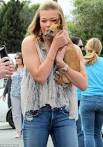 LeAnn Rimes cuddles up to cute as a button rescue puppies at