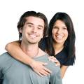 Smiling young latin couple piggyback - Latin Dating Sites