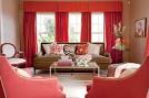 beige and red living room with coral red curtains and armchairs ...