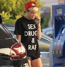 Miley Cyrus teams her 'Sex, Drugs and Rap' T-shirt with a pair of