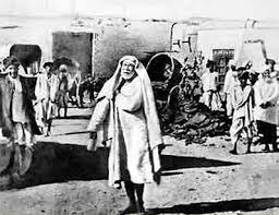 Sai Baba on his daily begging Sai Baba on his daily begging