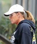 BRUCE JENNER sports diamond earrings, manicure and ponytail - NY.