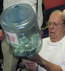 Treasurer Ralph Hayward appears determined to count the challenge money that accumulated during the kickoff. - bvl2002_hayward