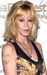 Melanie Griffith Covers Up Antonio Banderas Tattoo and Moves.