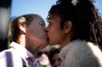 Same-sex couple Lori Campbell (left) and Maja Roble kiss after exchanging ... - s_k28_RTR2XV3K