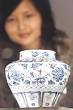 A visitor looks at a Guan Yuan dynasty jar due for auction at the Sotheby's ... - biz2