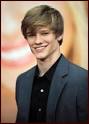 -Lucas Till shows off his smile at the premiere of Hannah Montana: The Movie ...
