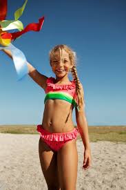 little girl bikini|Little girl in bikini, swim-cap and goggles looking at ...