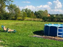 Rajce.idnes.child|Happy kids fight trying to ride donut floats in outdoor swimming pool on  sunny