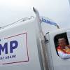 Trump Boards Garbage Truck