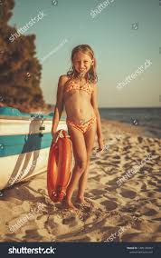 beach little garl|Active little girl playing and having fun at the beach – Jacob Lund  Photography Store- premium stock photo
