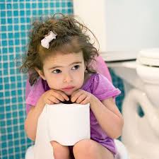 pooping little girl |Baby Poop: Concentrated Girl Sitting On The Big Stones» del colaborador de  Stocksy «Anfisa&friends» - Stocksy