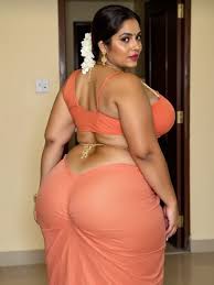 fat indian ass and tits|青い網目のサリーを着たインド人のおばさんが、胸の谷間が綺麗で、ふっくらとした腹筋と大きなお尻を持ち、スタジオの照明の下で脚を見せている -  SeaArt AI