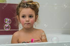 bath child girl|young girl sits in portable bath tub, facing right & looking forward,  holding stuffed rabbit under her right arm - TuckDB Postcards