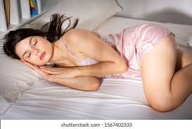 Young woman of color wearing a sleep mask resting on her back jpg x Sleeping hot sex