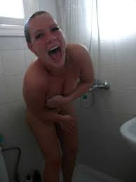 Busty teen caught having fun in shower jpg x Girl caught naked