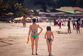 mom and daughter nudist|Adobe Stock
