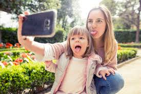 mother daughter tongue|Mother and child sticking out tongues in bathroom Stock Photo - Alamy