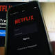 UPDATE-4-Netflix blames weak US subscriber adds on new chip-based cards 