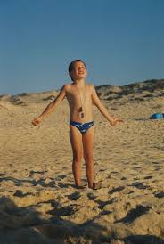 Little topless girl on beach|Little Child Sitting On Towel By Stock Photo 1221043915 | Shutterstock