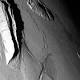 Squeezing out mountains, mathematically, on Jupiter's moon Io 