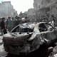 Car bomb, mortar attacks in Syria's 2 major cities kill 54