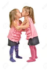 two little girls kissing|
