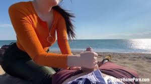 A risky public beach handjob with cumshot and big natural tits from a large boobed amateur milf wife jpg x Handjobs on the beach